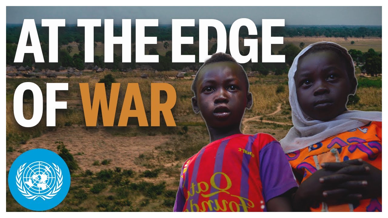 A boy and a girl staring at camera.