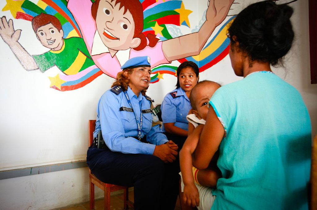 UN police officer Shahzadi Gulfam (left) and PNTL officer Maria de Fátima de Jesus, from the Dili district’s Vulnerable Persons Unit, investigate a case of domestic violence. Shahzadi Gulfam was the recipient of the 2011 International Female Police Peacekeeper Award