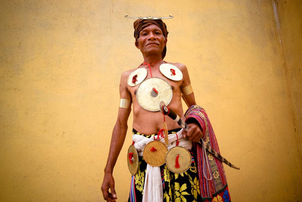 Elder wears the traditional dress of Ainaro district with ornaments signifying heroism