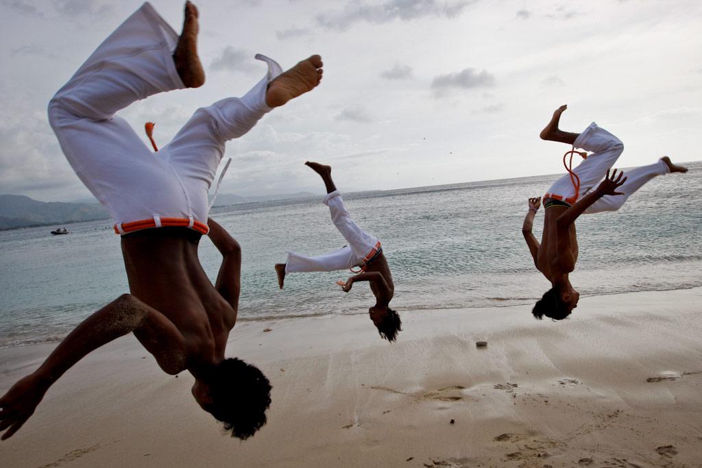 Members of the dance troupe Movimento de Adolescentes e Crianças practice Capoeira