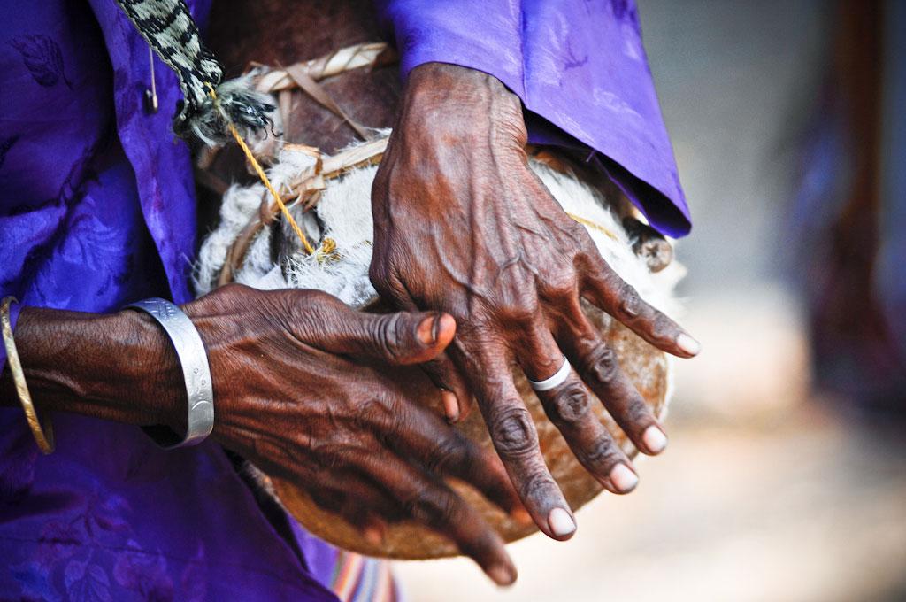 Woman plays a baba-dook at a traditional ceremony in the village of Hera, east of Dili