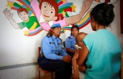 UN Police officer and Timorese Police officer conducting an interview with a victim of domestic viol