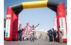 A Timorese cyclist celebrates at the finish line of the Tour de Timor. Photo by UNMIT/Sandra Black